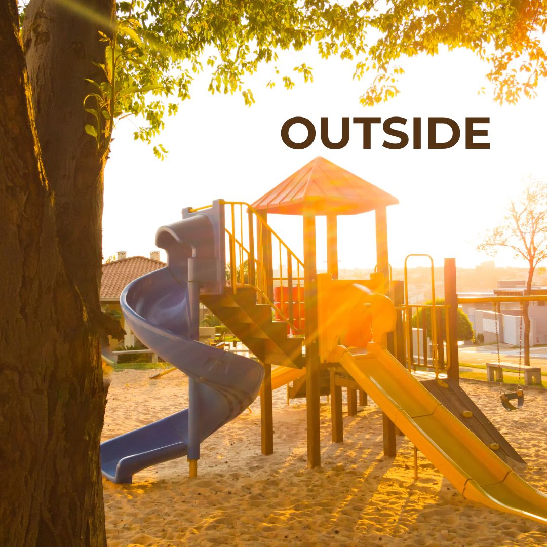 kid's playground equipment at sunset