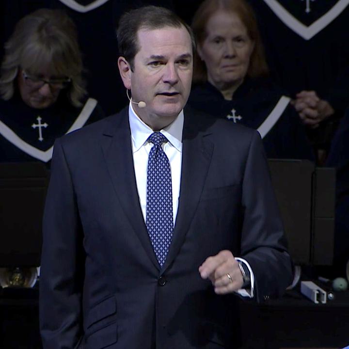 Steve Wells addressing the congregation during worship