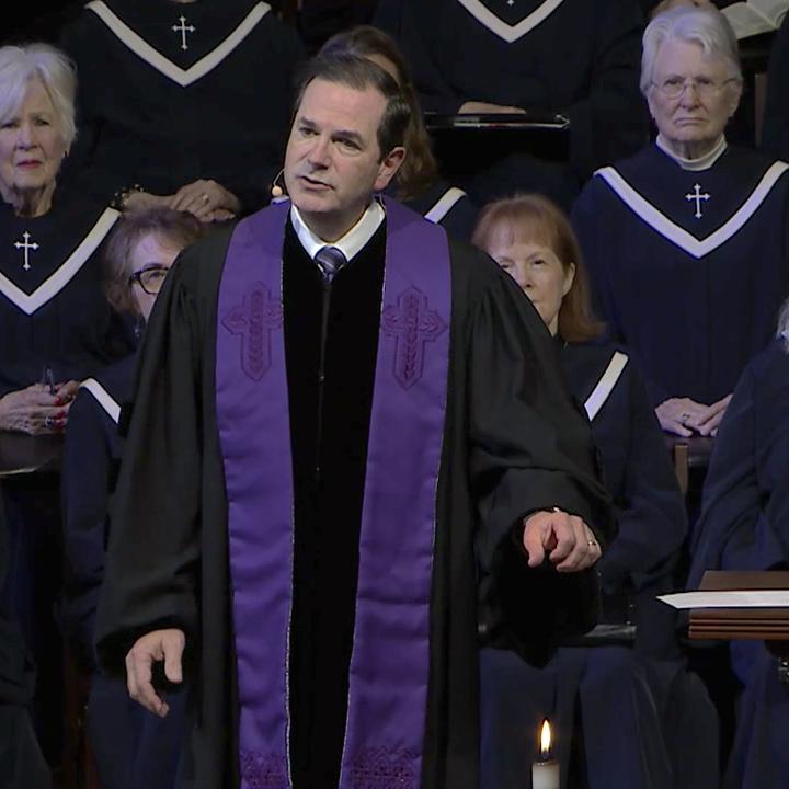 Steve Wells addressing the congregation during worship