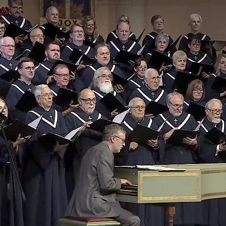 sanctuary choir singing in advent worship with a harpsichord