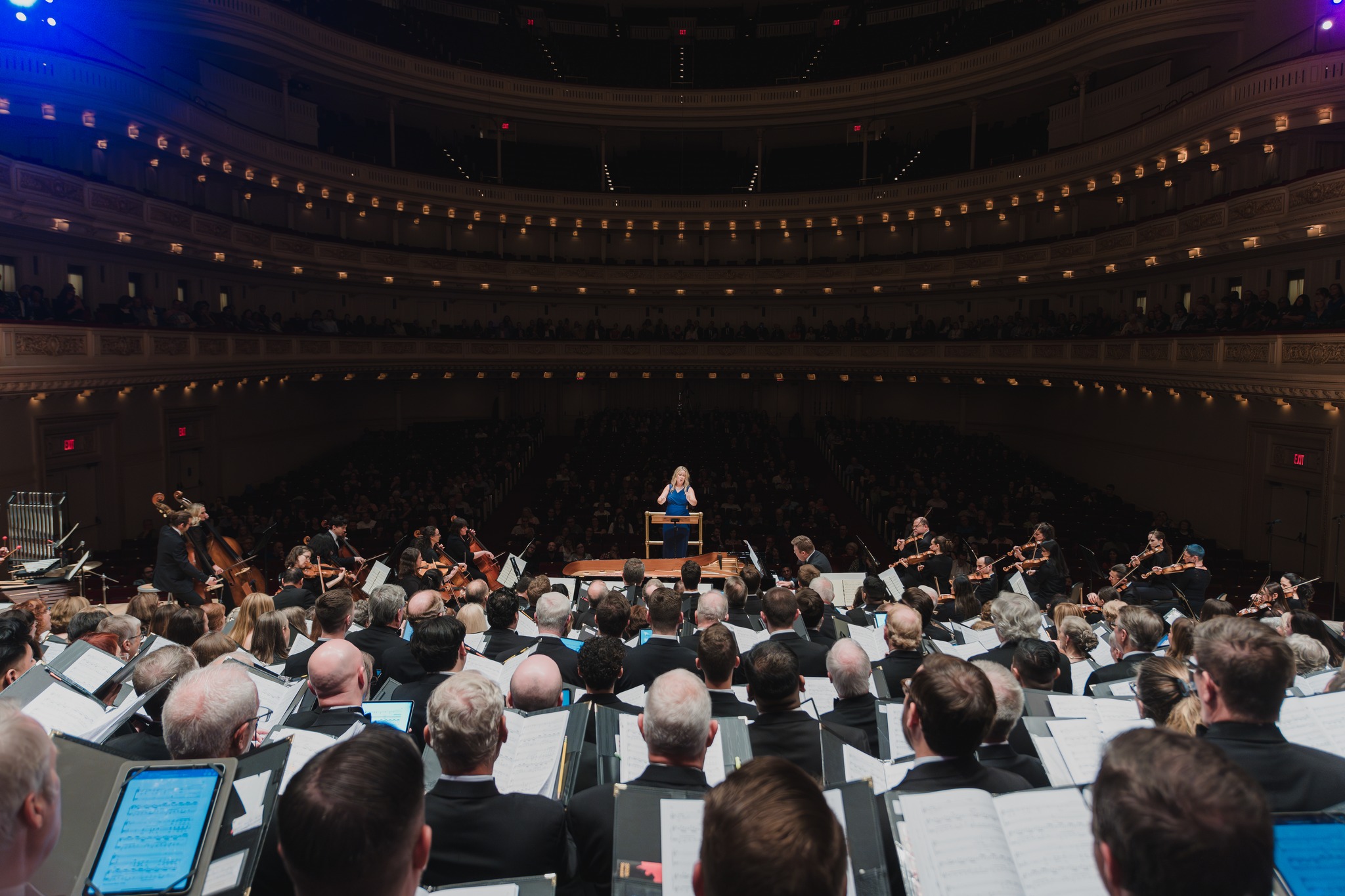 photo of a choir facing the audience at carnegie hall 