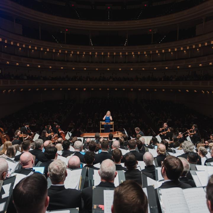 photo of a choir facing the audience at carnegie hall 