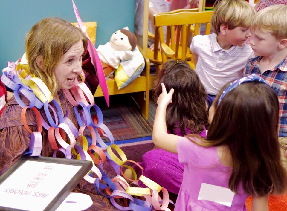 Dolores Rader talking to preschool girl