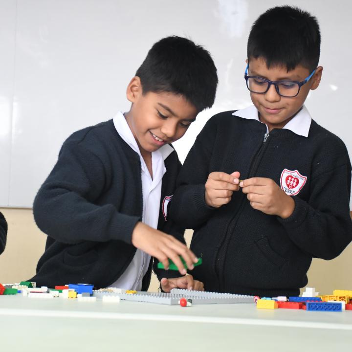 two boys playing with legos