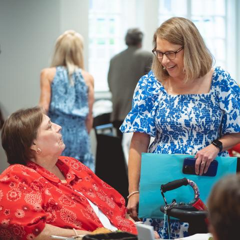 susan moore talking to congregant